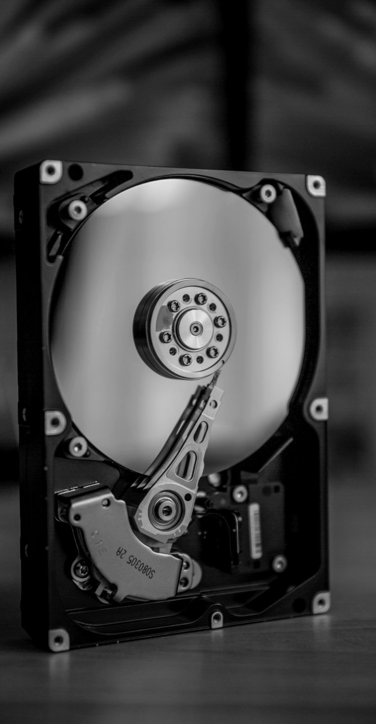 Open hard disk drive standing upright
