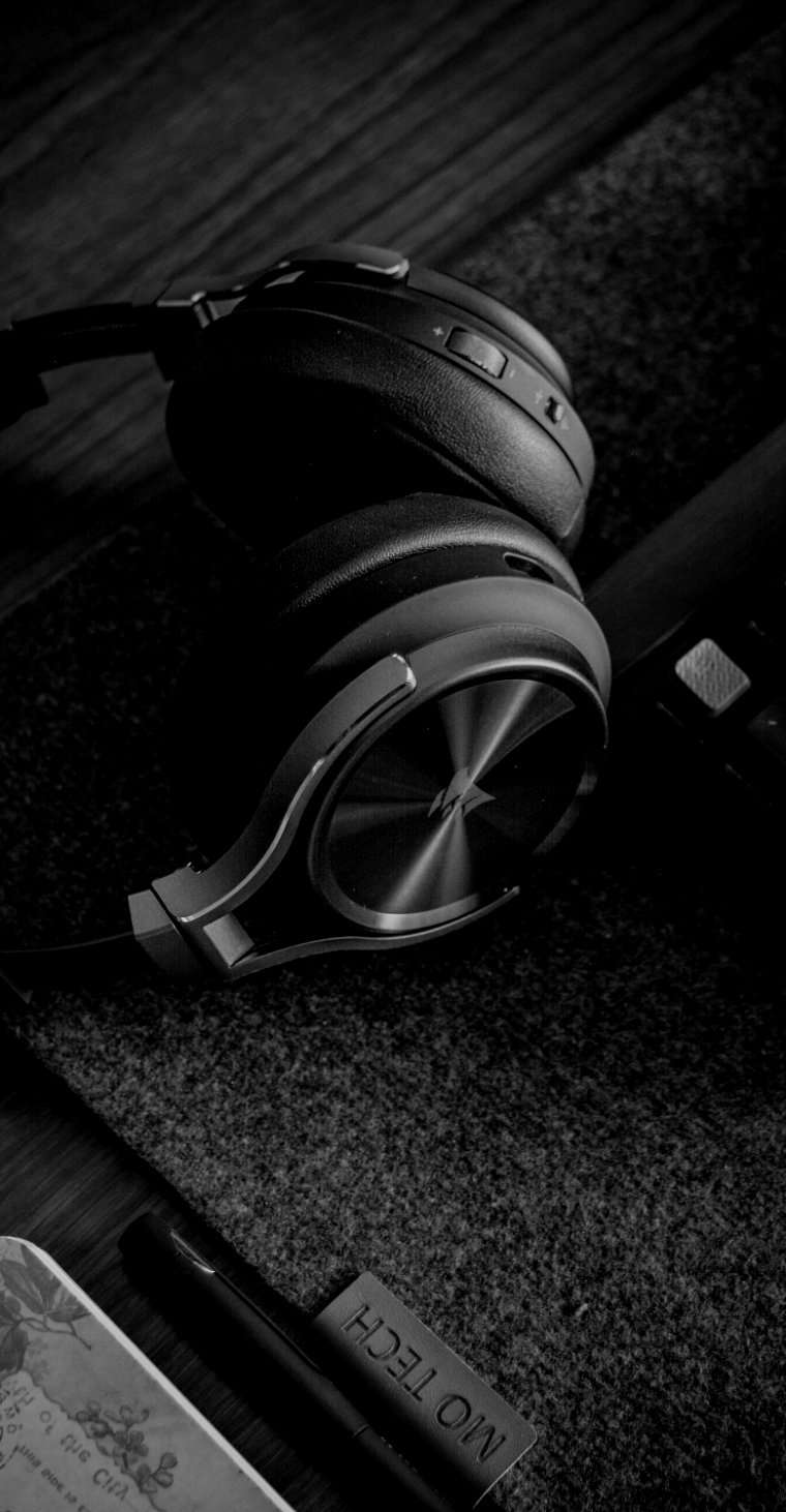 Headphones on a dark desk